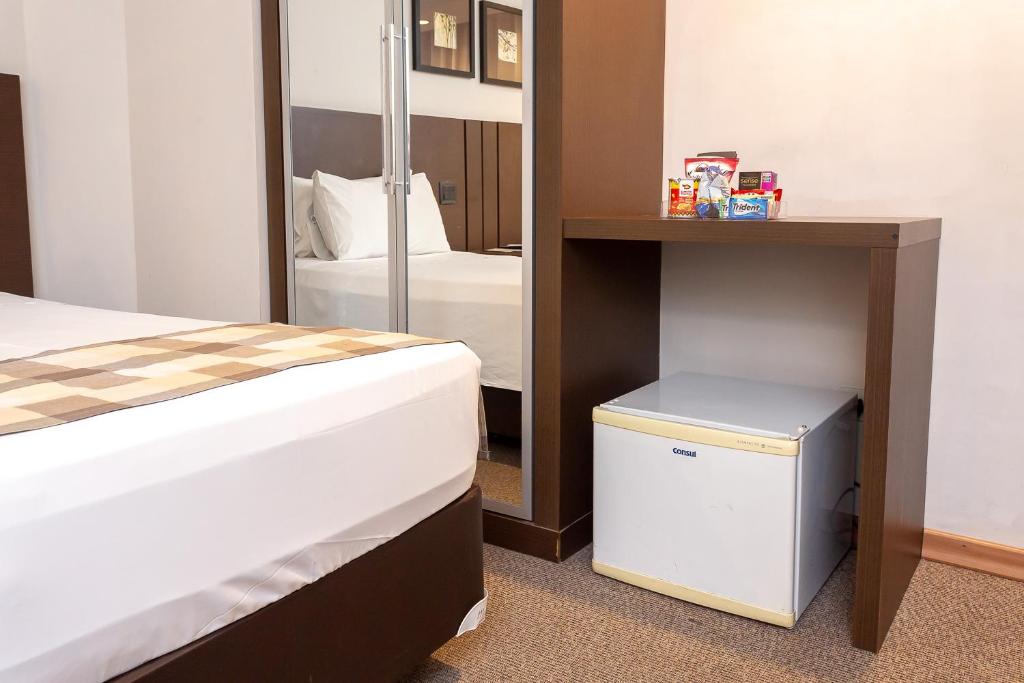 Cama ou camas em um quarto em Roochelle Hotel by Nobile