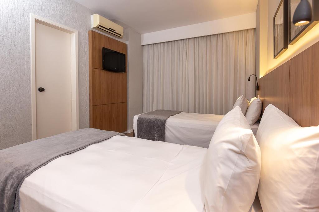 Cama ou camas em um quarto em Roochelle Hotel by Nobile