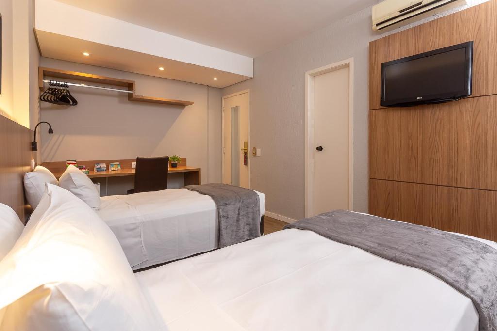 Cama ou camas em um quarto em Roochelle Hotel by Nobile