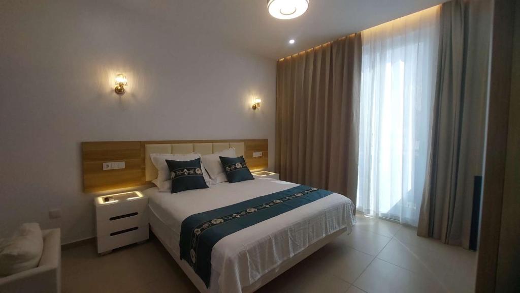 Postel nebo postele na pokoji v ubytování Lily holiday hotel