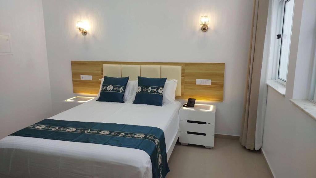Postel nebo postele na pokoji v ubytování Lily holiday hotel