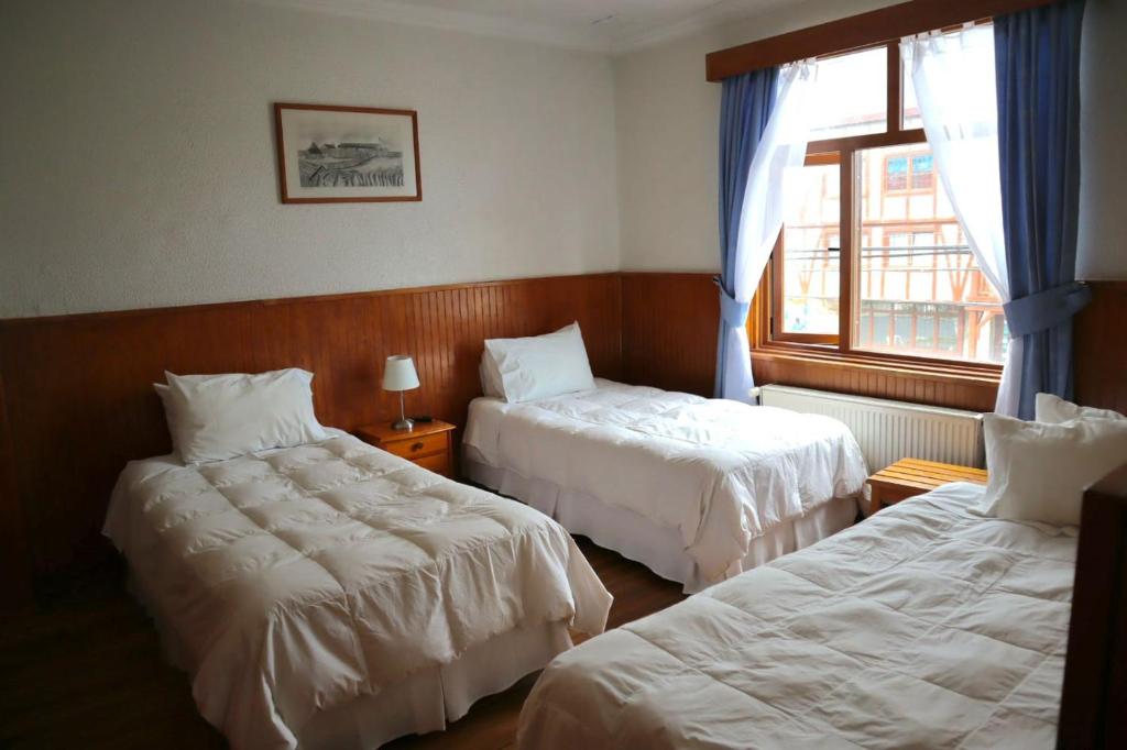 Postel nebo postele na pokoji v ubytování CHALET CHAPITAL Punta Arenas