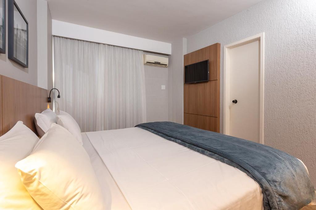 Cama ou camas em um quarto em Roochelle Hotel by Nobile
