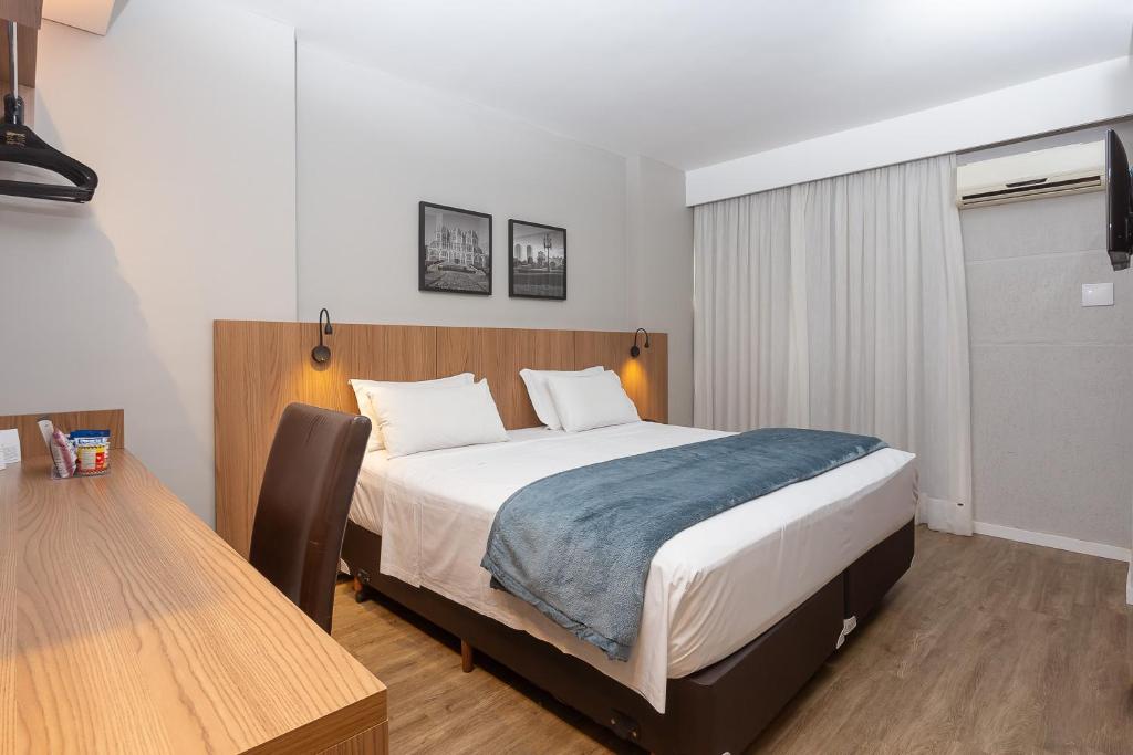 Cama ou camas em um quarto em Roochelle Hotel by Nobile
