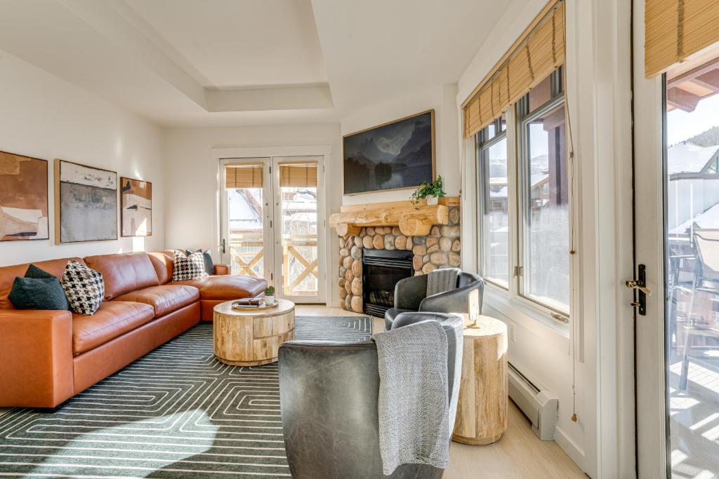 a living room with a couch and a fireplace at Walk to Lifts Copper Mtn Condo in Center Village in Frisco