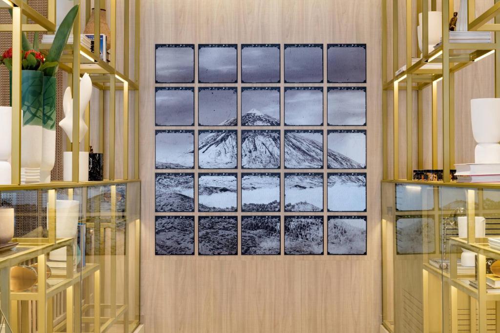 a framed picture of mountains on a wall in a store at AC Hotel by Marriott Tenerife in Santa Cruz de Tenerife