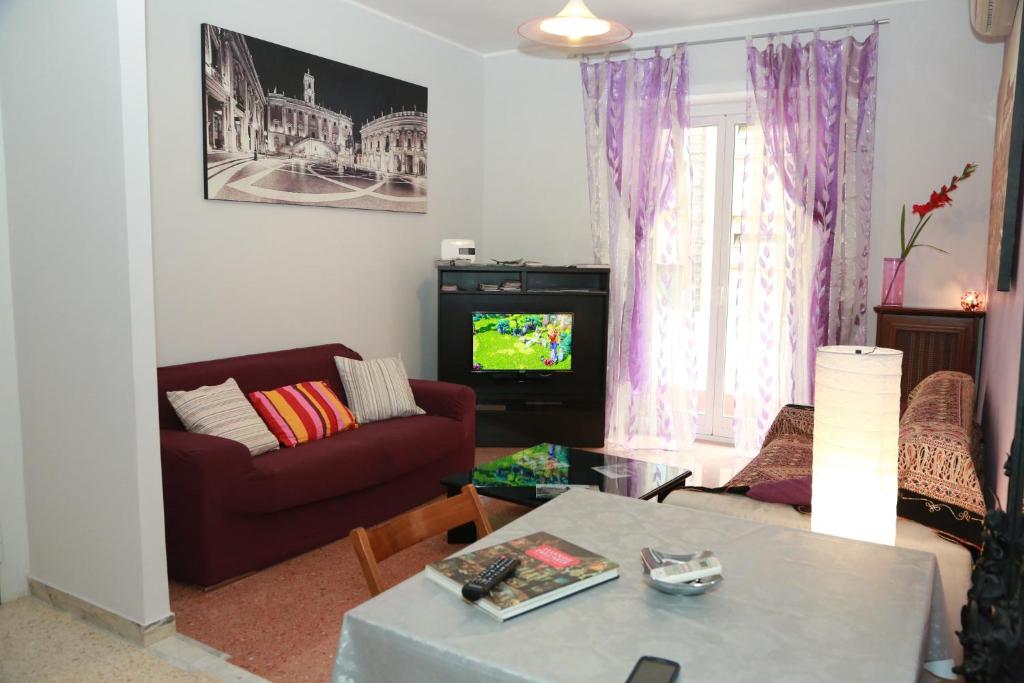 a living room with a couch and a table at Laura's Apartment Vatican in Rome