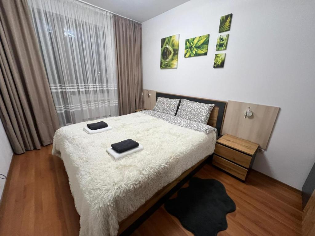 Postel nebo postele na pokoji v ubytování VIP Apartment Belvedere Club