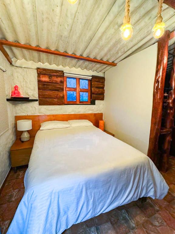 Postel nebo postele na pokoji v ubytování Riverside La Masía Ecohotel