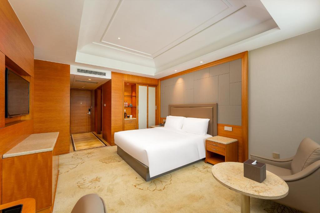 Postel nebo postele na pokoji v ubytování 上海戴斯温德姆酒店 Shanghai Days Wyndham Hotel