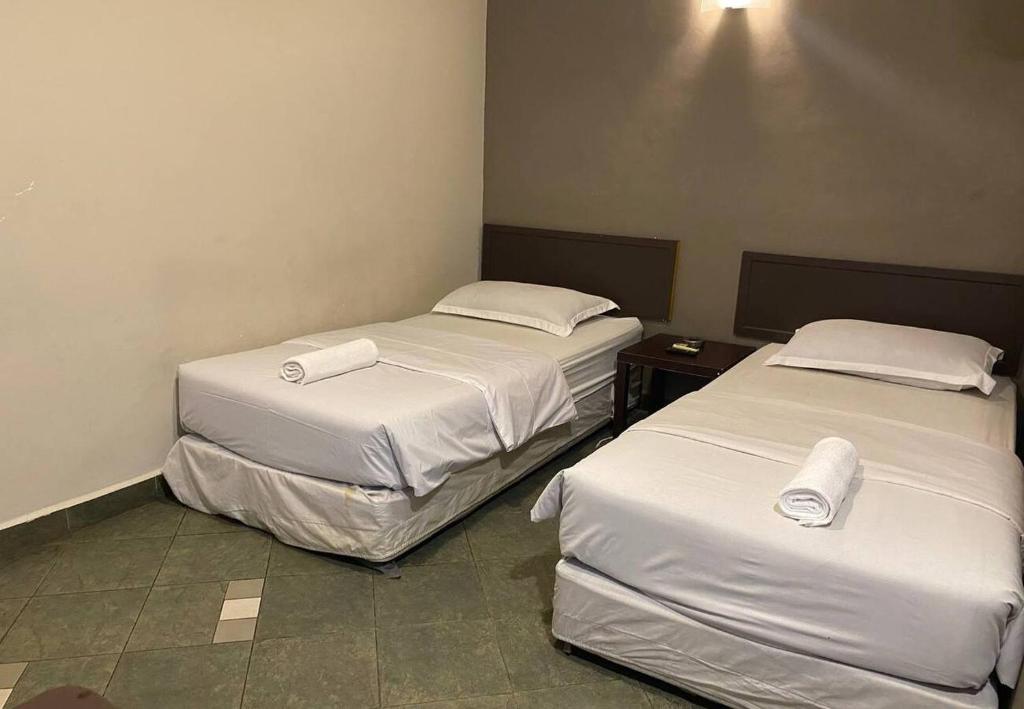 Postel nebo postele na pokoji v ubytování Hotel Harbour Inn