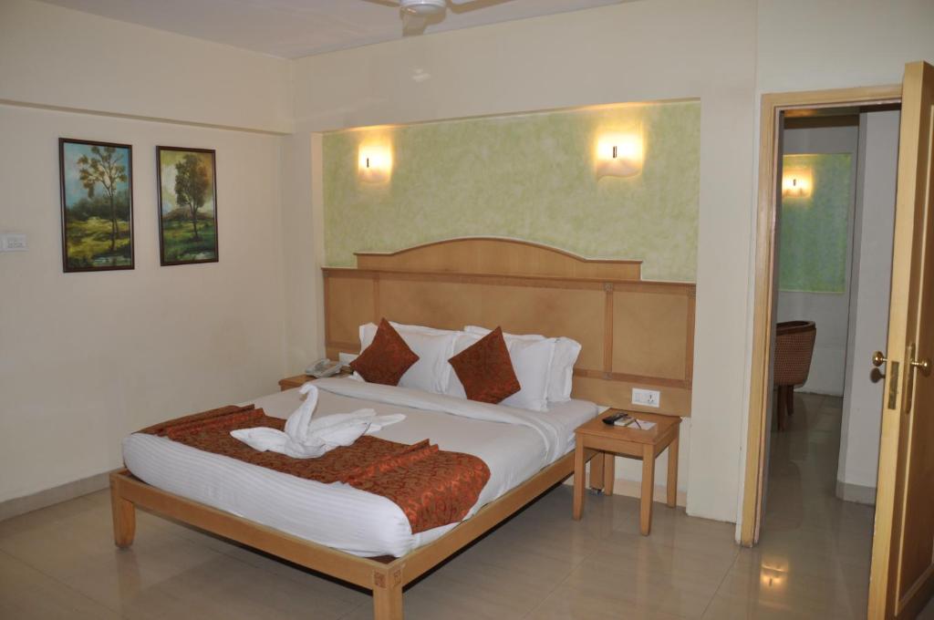 Postel nebo postele na pokoji v ubytování Hotel Abigail Regency