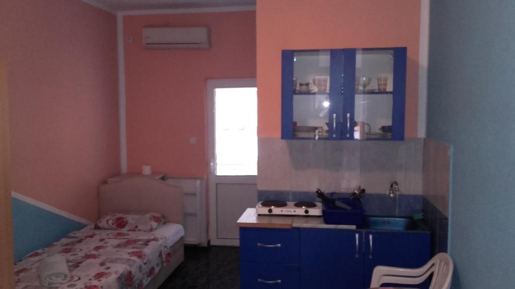 Łóżko lub łóżka w pokoju w obiekcie Guest House Dragomir