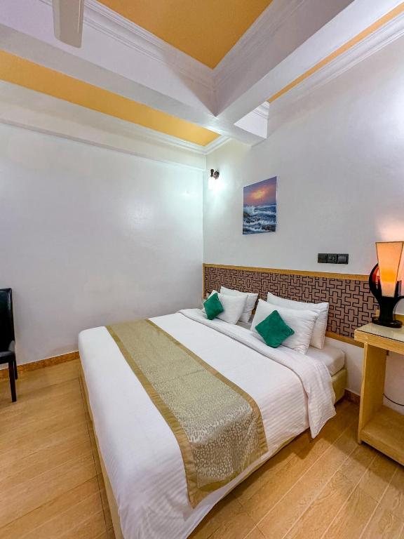 Postel nebo postele na pokoji v ubytování Sevinex Inn