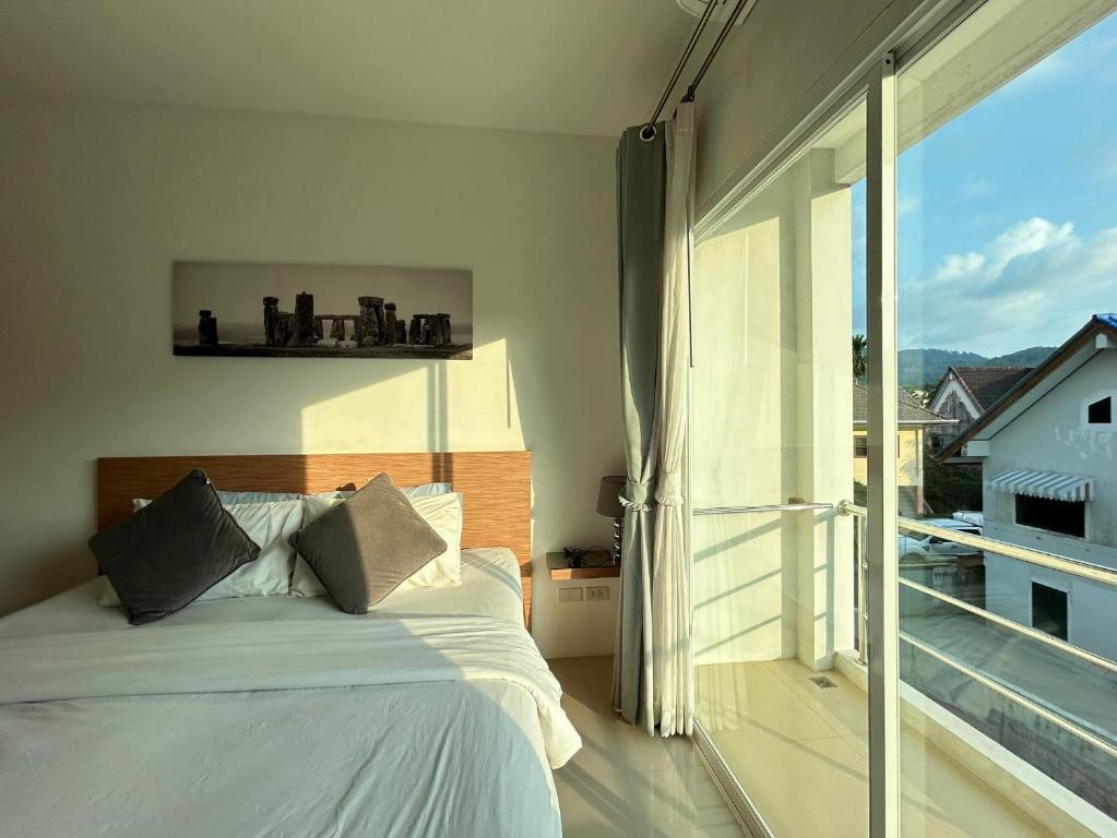Postel nebo postele na pokoji v ubytování Clear House Resort - SHA Extra Plus