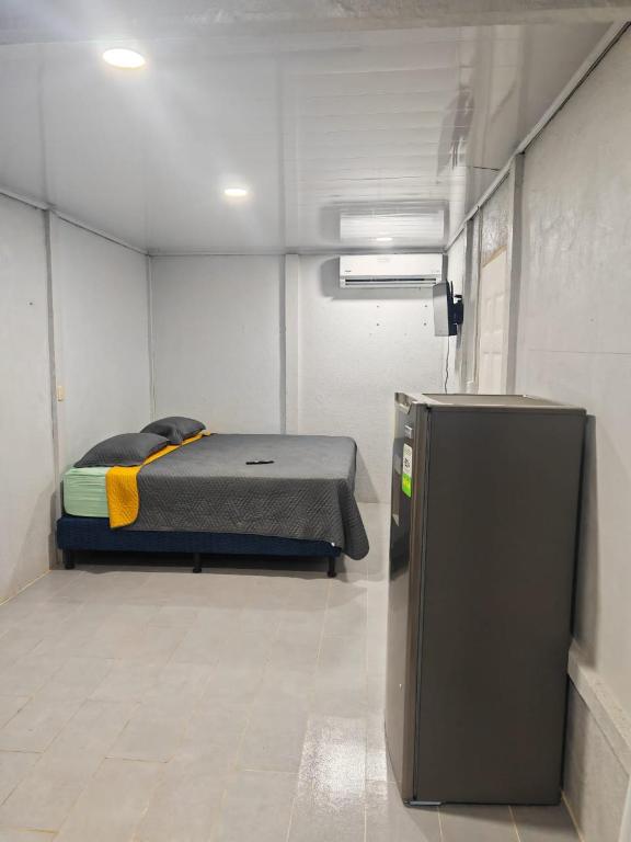 Ένα ή περισσότερα κρεβάτια σε δωμάτιο στο Apartamento Roxana