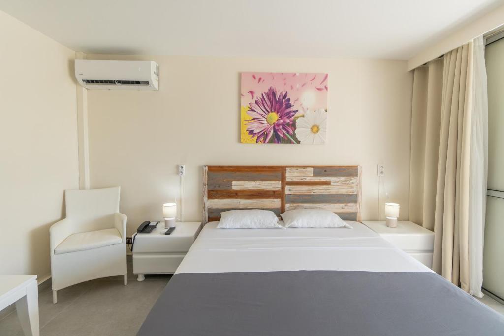 Uma cama ou camas num quarto em Canella Beach Hotel