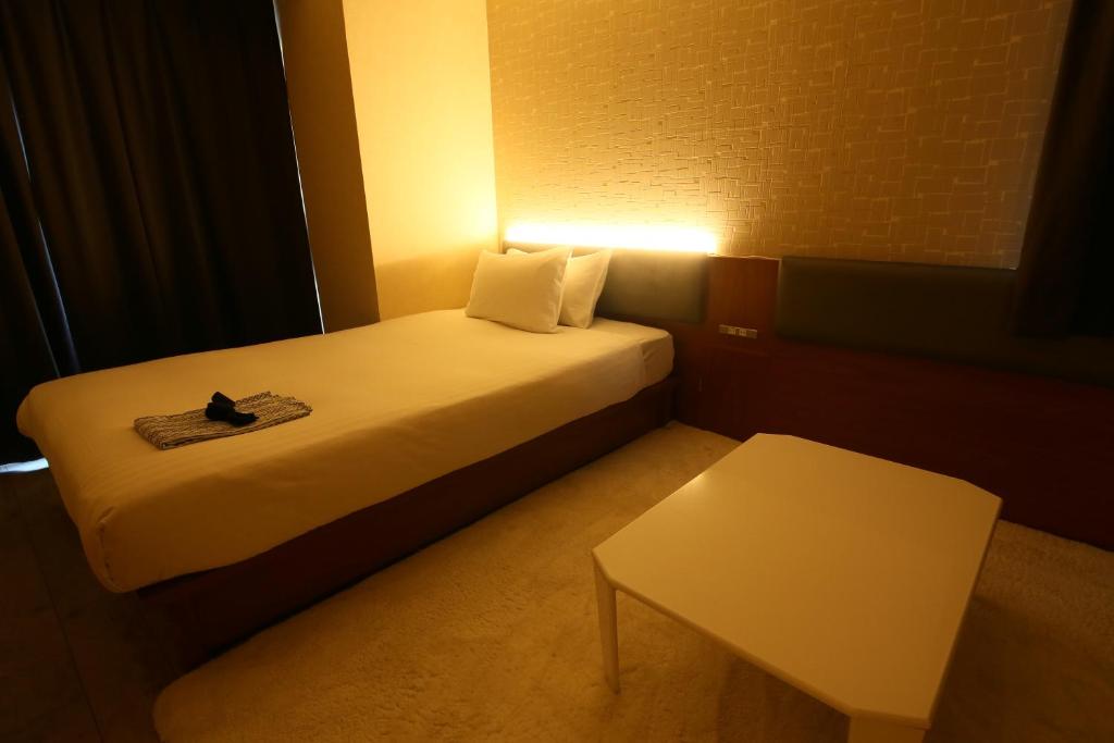Postel nebo postele na pokoji v ubytování Hotel Trad