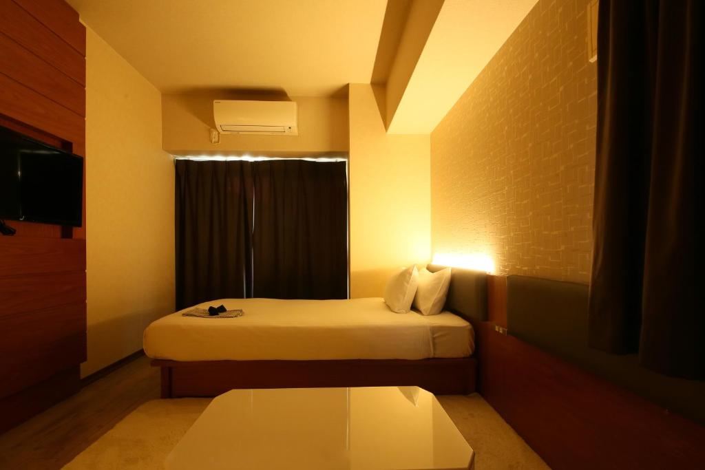 Postel nebo postele na pokoji v ubytování Hotel Trad