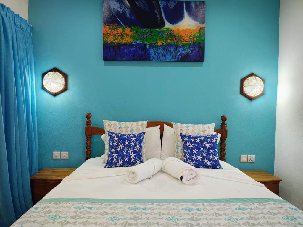 Ένα ή περισσότερα κρεβάτια σε δωμάτιο στο The Islander Hotel