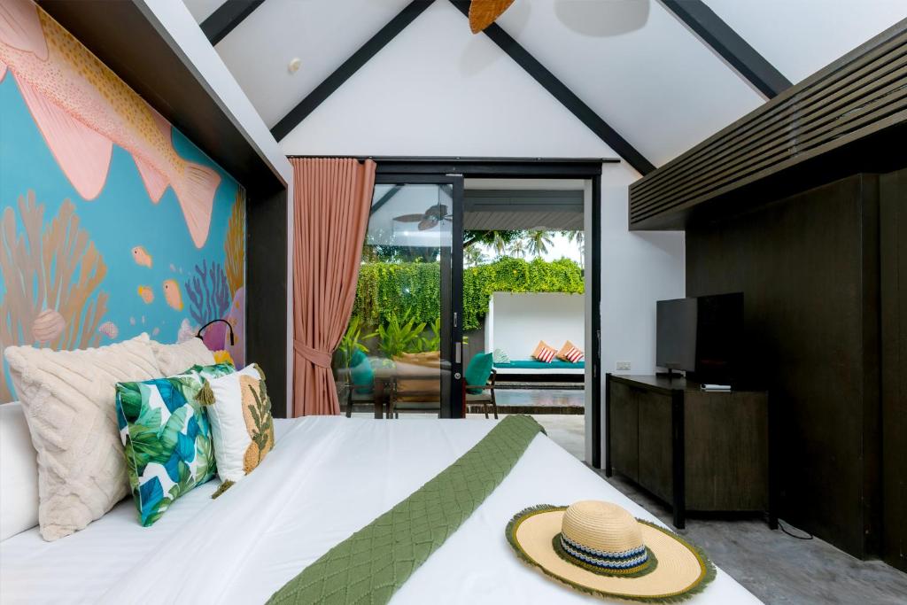 Postel nebo postele na pokoji v ubytování Tolani Resort Koh Samui