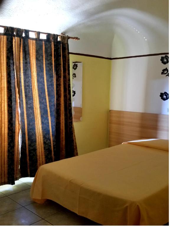 Postel nebo postele na pokoji v ubytování Hotel Stazione