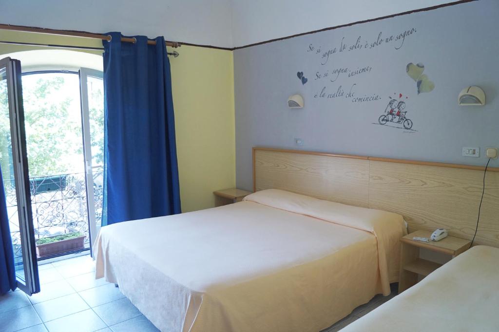 Postel nebo postele na pokoji v ubytování Hotel Stazione
