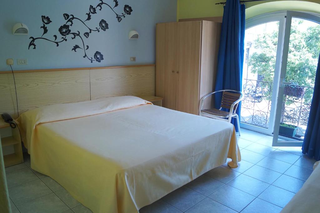 Postel nebo postele na pokoji v ubytování Hotel Stazione
