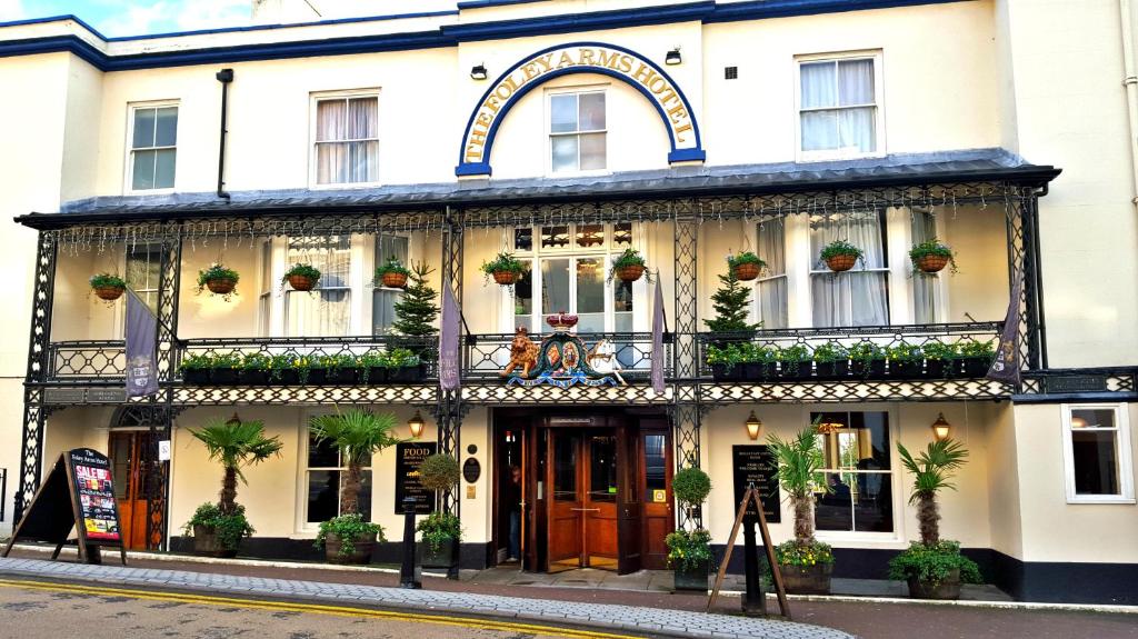 
a large building with a large window on the side of it at The Foley Arms Hotel Wetherspoon in Great Malvern
