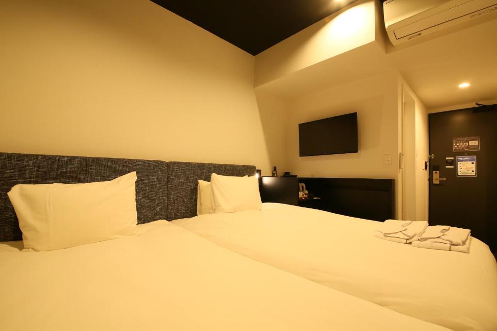 Postel nebo postele na pokoji v ubytování HOTEL TRAD Replay