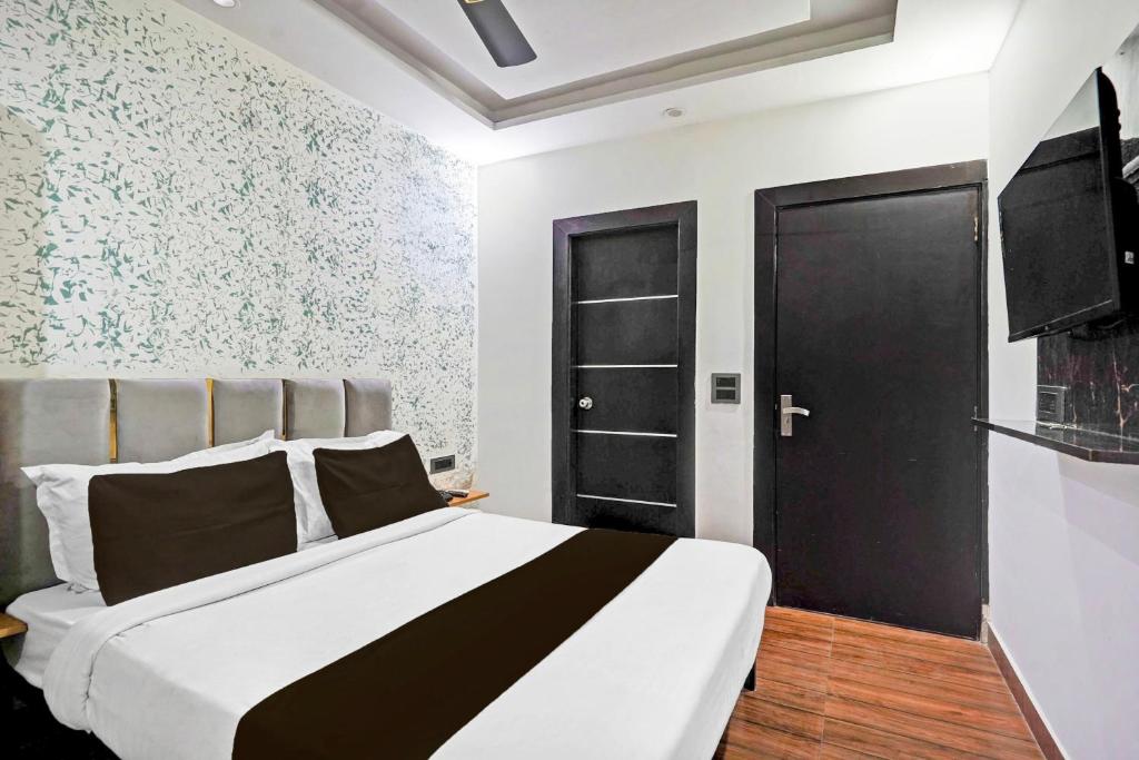 Postel nebo postele na pokoji v ubytování TWAMEV RESIDENCY