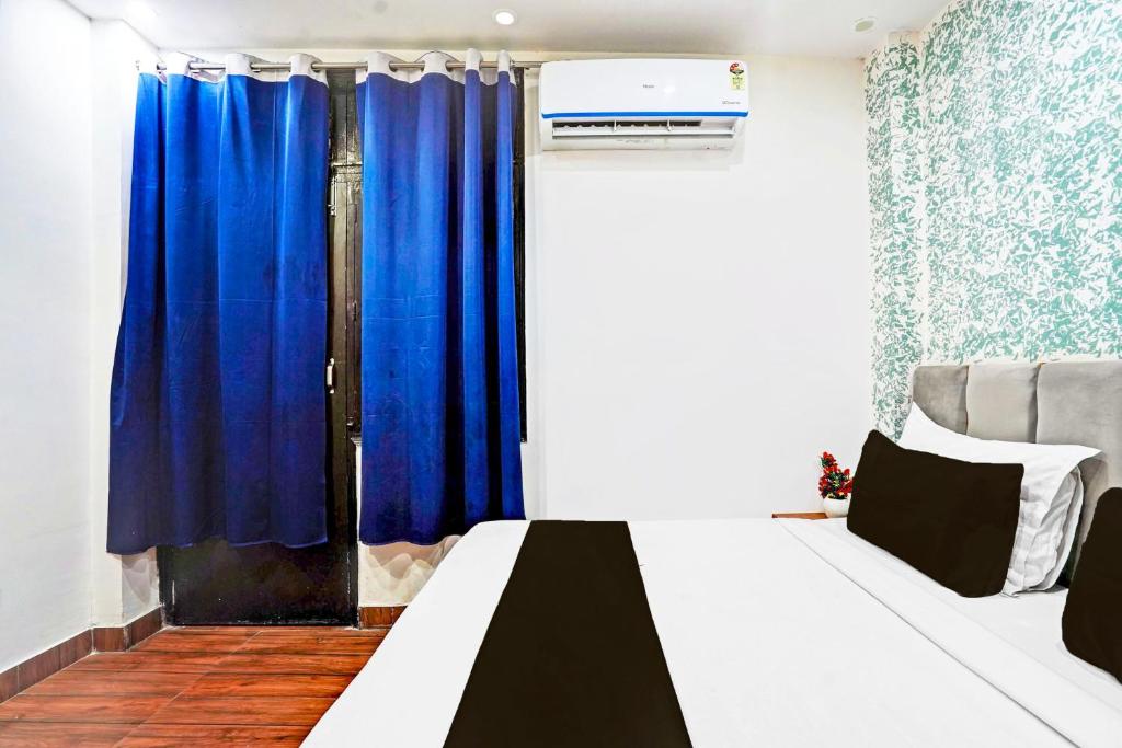 Postel nebo postele na pokoji v ubytování TWAMEV RESIDENCY