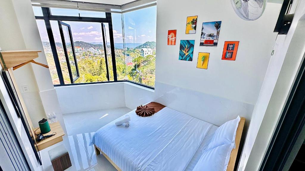 Ένα ή περισσότερα κρεβάτια σε δωμάτιο στο Villa Đà Lạt Trung Nghĩa