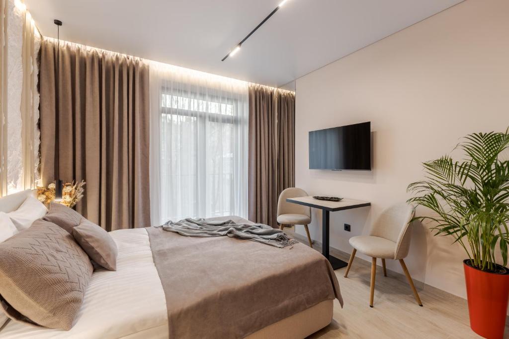 Postel nebo postele na pokoji v ubytování ACCENT Apart-Hotel
