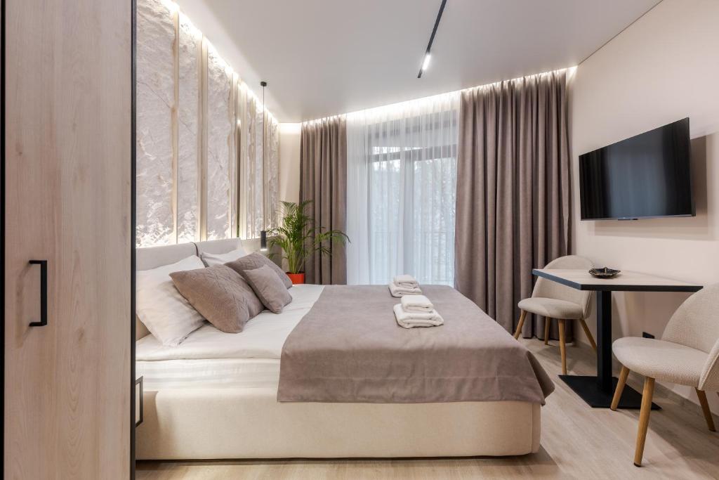 Postel nebo postele na pokoji v ubytování ACCENT Apart-Hotel