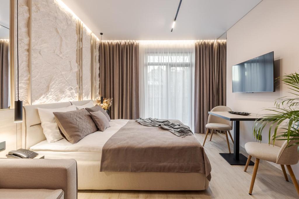 Postel nebo postele na pokoji v ubytování ACCENT Apart-Hotel