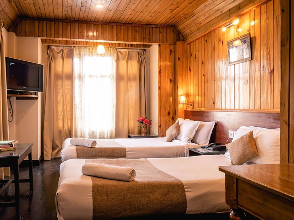 Postel nebo postele na pokoji v ubytování Villa Everest