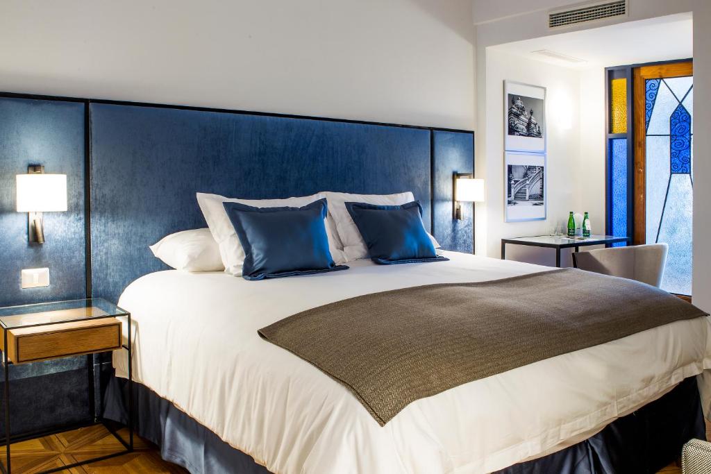 Postel nebo postele na pokoji v ubytování Hotel Luciano K
