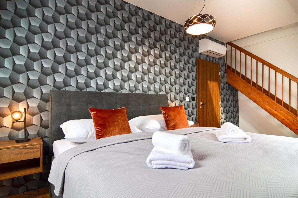 Postel nebo postele na pokoji v ubytování Residence Barrique Valtice - private wellness