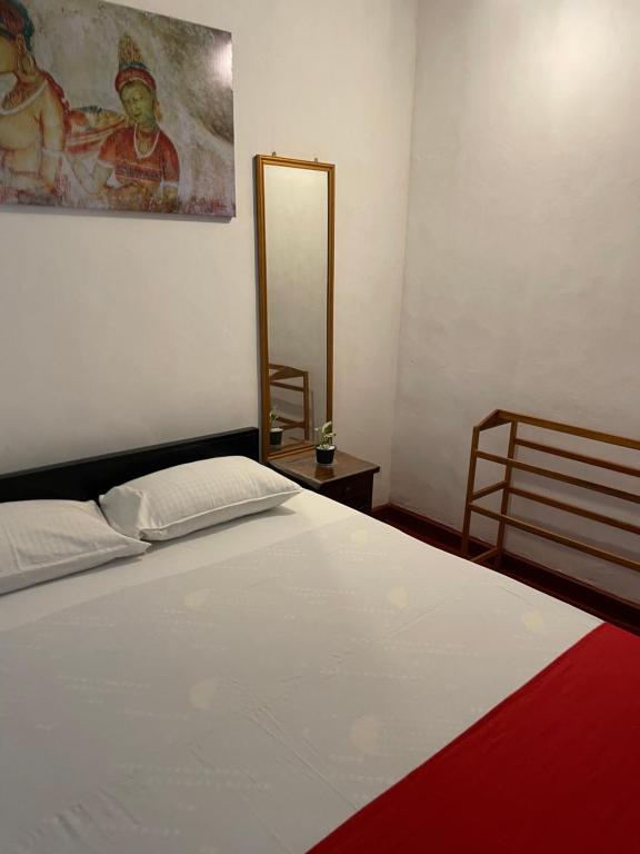 Postel nebo postele na pokoji v ubytování Olivia HomeStay
