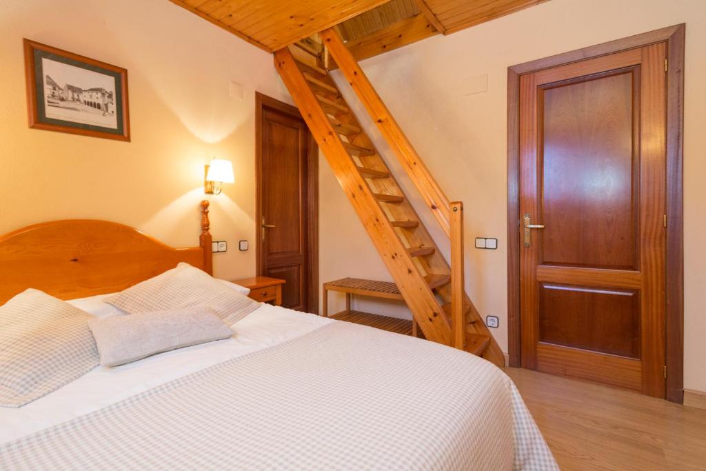 Postel nebo postele na pokoji v ubytování Hostal Casa Rosita