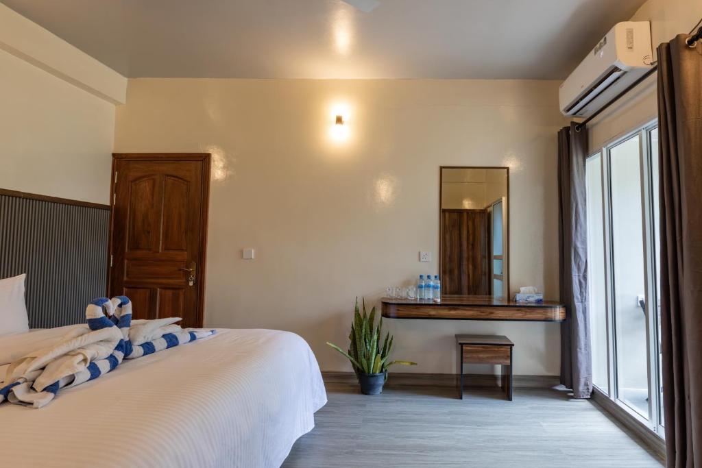 Postel nebo postele na pokoji v ubytování Dhoadhi Beach Maldives