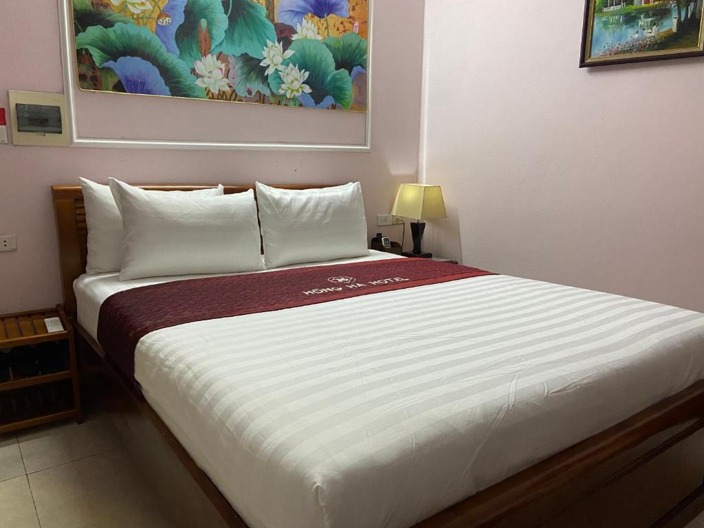 Postel nebo postele na pokoji v ubytování Hong Ha Airport Hotel