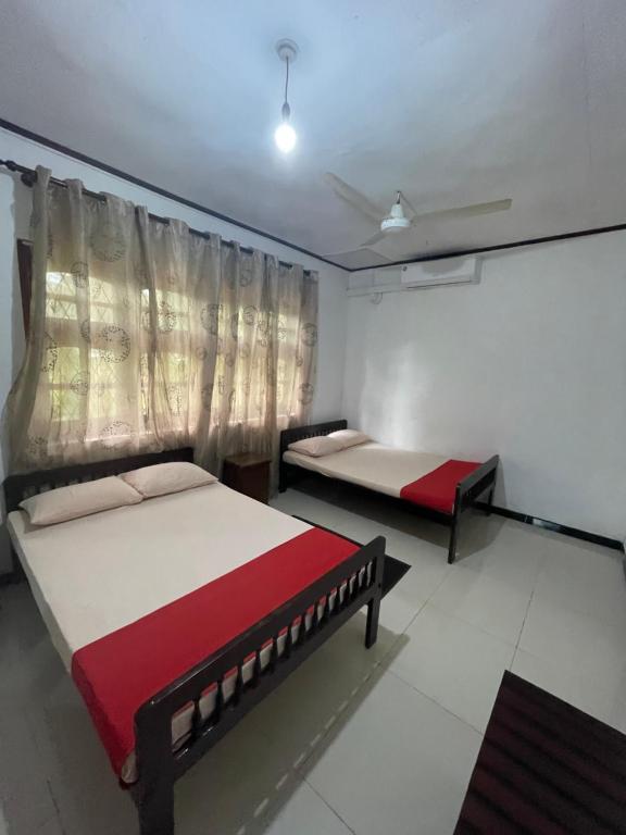Postel nebo postele na pokoji v ubytování Olivia HomeStay