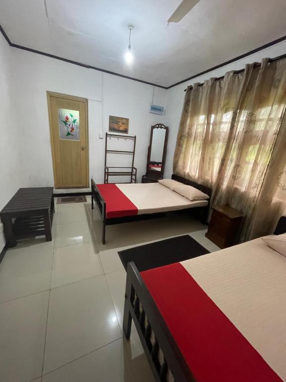 Postel nebo postele na pokoji v ubytování Olivia HomeStay