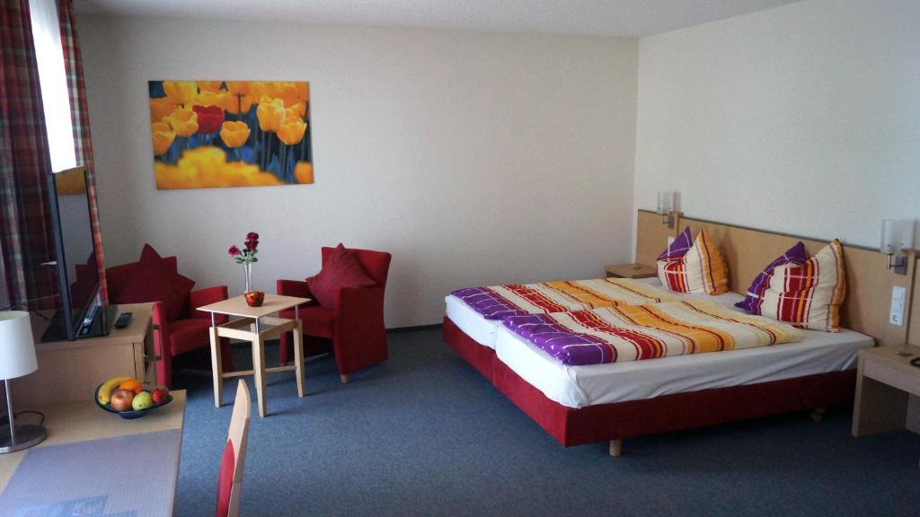 Postel nebo postele na pokoji v ubytování Andi´s Steakhüsli & Hotel
