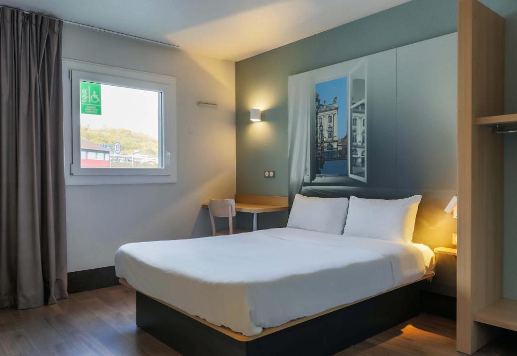 Postel nebo postele na pokoji v ubytování B&B HOTEL Nancy Frouard