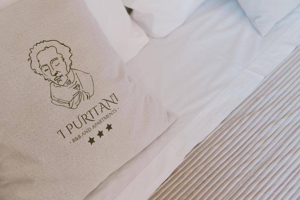 Postel nebo postele na pokoji v ubytování B&B I Puritani