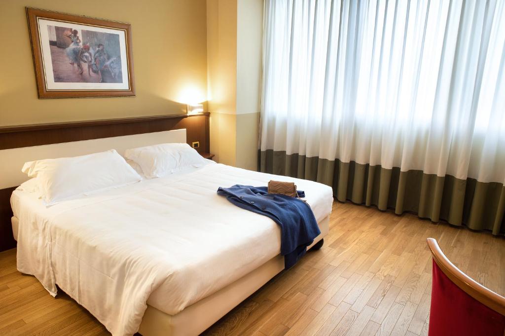 Postel nebo postele na pokoji v ubytování Hotel Alga