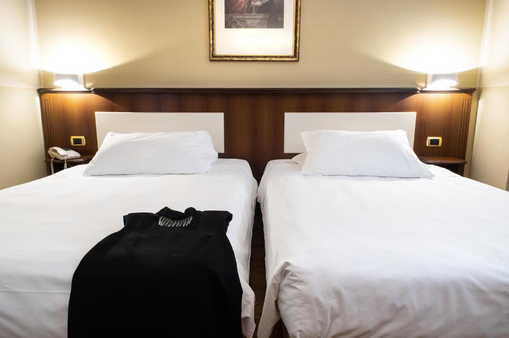Postel nebo postele na pokoji v ubytování Hotel Alga